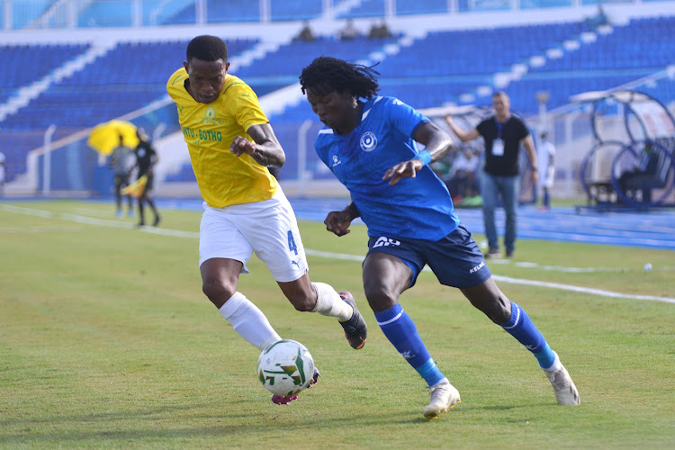 Mamelodi Sundowns defender Grant Kekana challenges Faris Abdalla of Al Hilal during their Caf Champions League match in Omdurman.