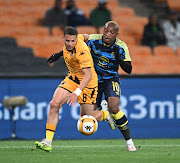 Cape Town City striker Khanyisa Mayo in a tussle for the ball with Yusuf Maart of Kaizer Chiefs during their DStv Premiership match at at FNB Stadium.