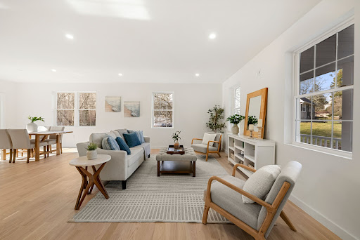 Bright living room with sofa and armchairs in this luxury property for sale in Westport ($849,999)