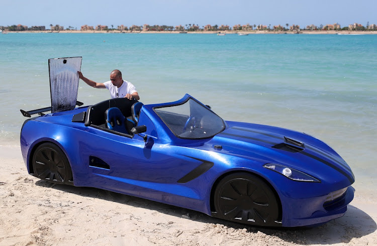 Karim Amin, 29 does a quick check at Porto Marina in Alexandria, Egypt .