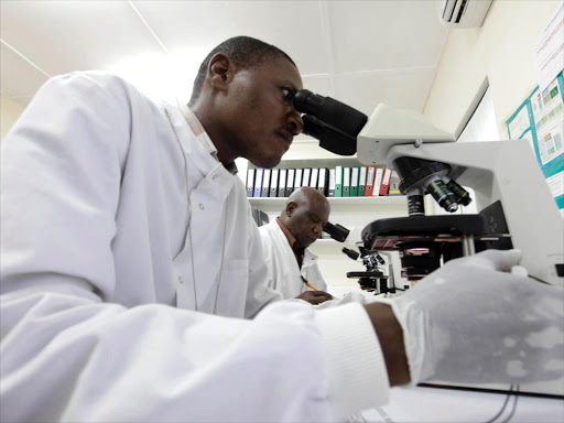 Kenya Medical Research Institute doctors research malaria at the clinical research facility laboratory in the Kenya coastal town of Kilifi, November 23, 2010. /REUTERS