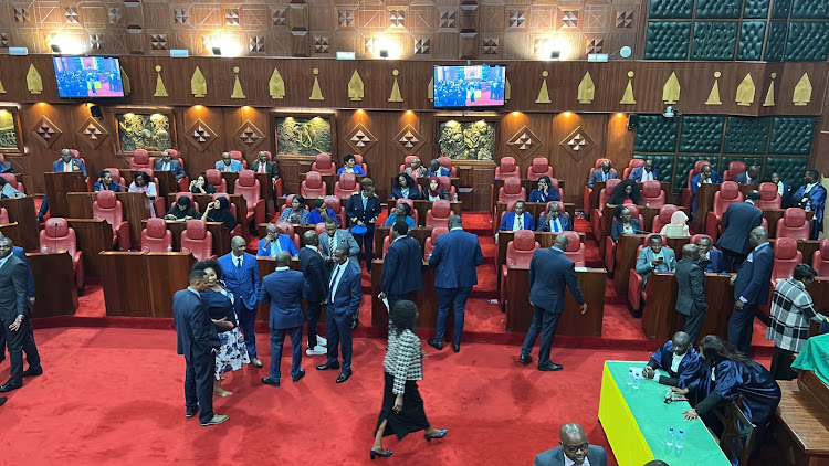 Members of the Nairobi county assembly consult ahead of round two of voting on Thursday, September 29.