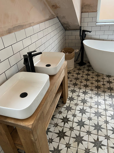 Re-plastered and tiled then fitted Free standing bath, Taps, His and hers sink.