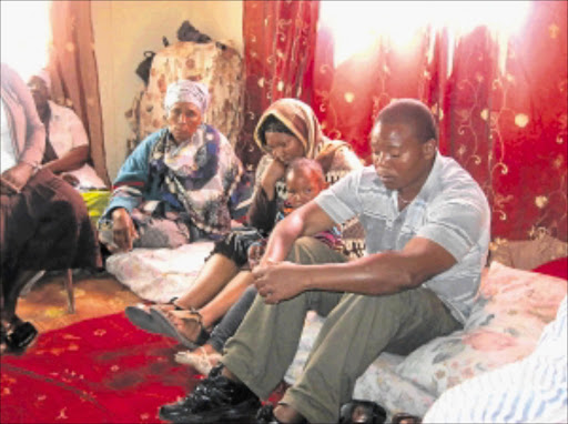 GRIEF: From left Mokgoanyane Mothibi (mother-in-law of late Tsatsi Mfete, insert ), his wife Nunu, their last born, Reabetswe, and younger brother Rapula. PHOTO: BOITUMELO TSHEHLE