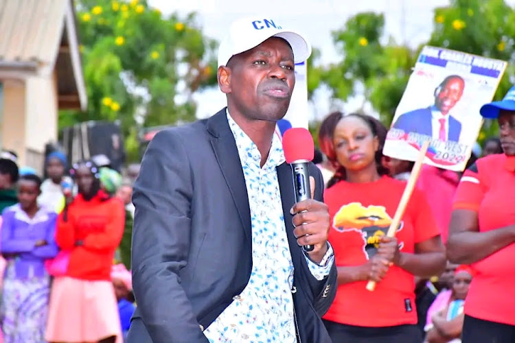 Mwingi West MP Charles Nguna addressing residents during his campaign tour at Nzaaiku market in Mwingi West on Sunday, July 10.