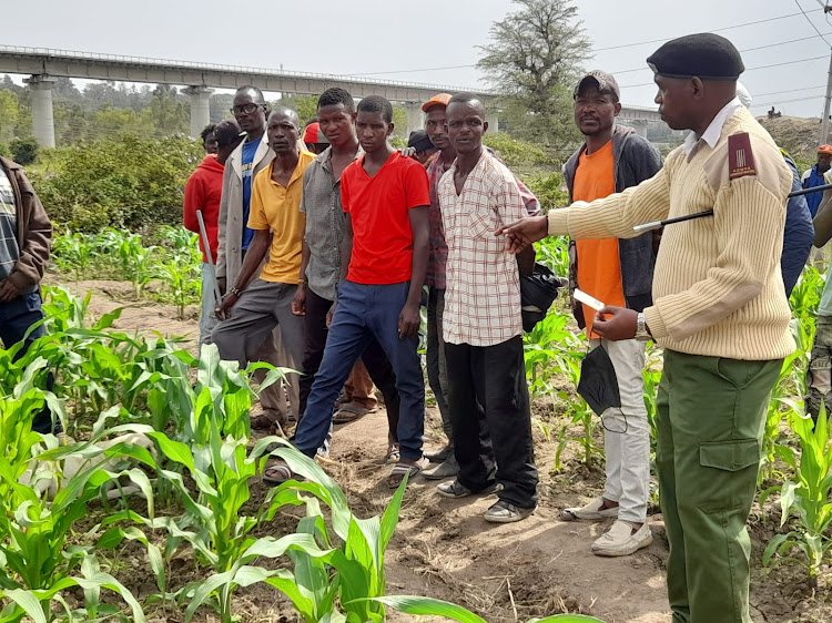 Athi River assistant chief Martin Ngomo leading the retrieval exercise on Tuesday, February 22.