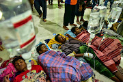 Rohingya refugees receive medical treatment after their arrival at the temporary shelter in Pidie, Aceh province, Indonesia, on December 26 2022.