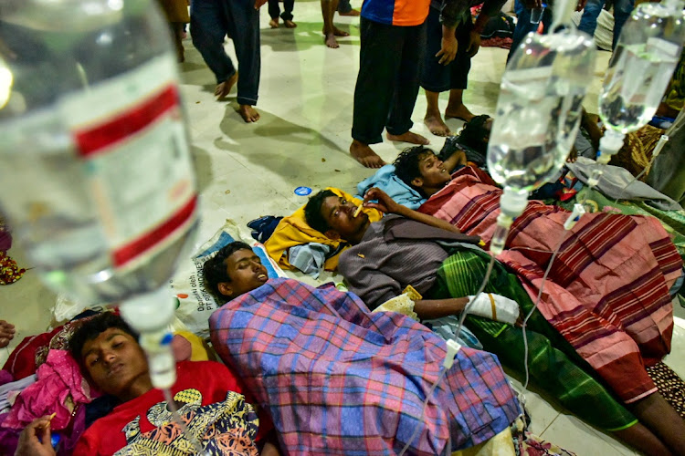 Rohingya refugees receive medical treatment after their arrival at the temporary shelter in Pidie, Aceh province, Indonesia, on December 26 2022.