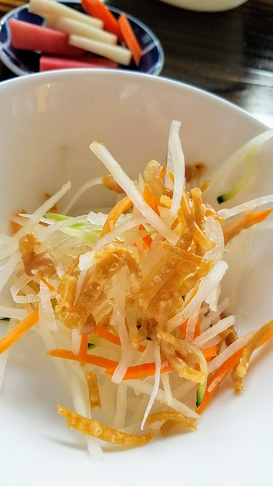 Marukin Ramen side (also available at happy hour) of light shredded daikon salad with ume plum vinaigrette