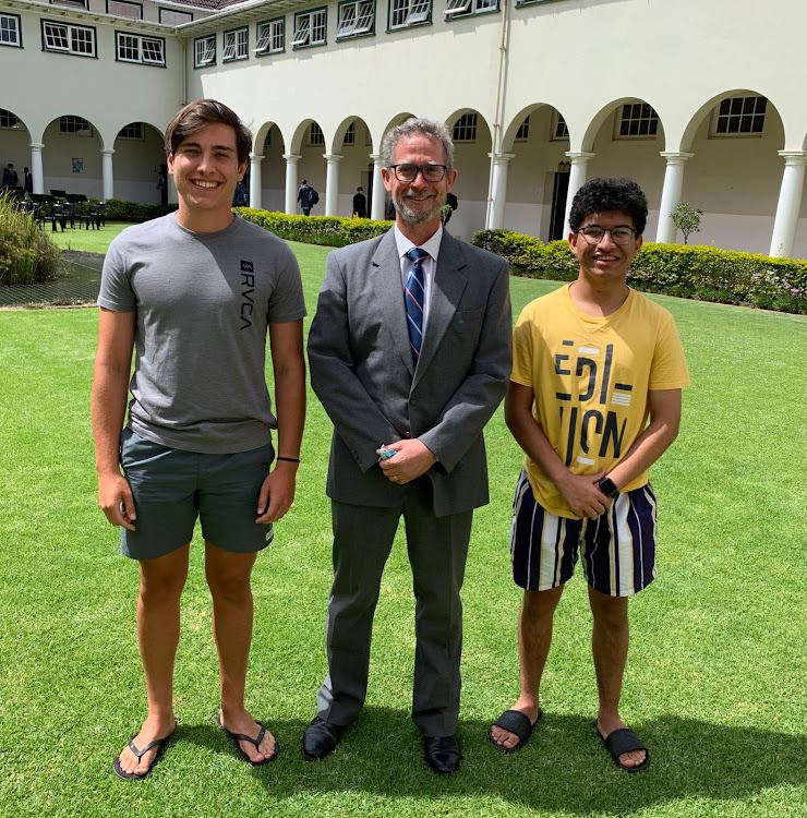 Grey High School rector Chris Erasmus with two of the school's top pupils who achieved 7 As, left, Tom Smith, 18, and Zach Heynes, 18