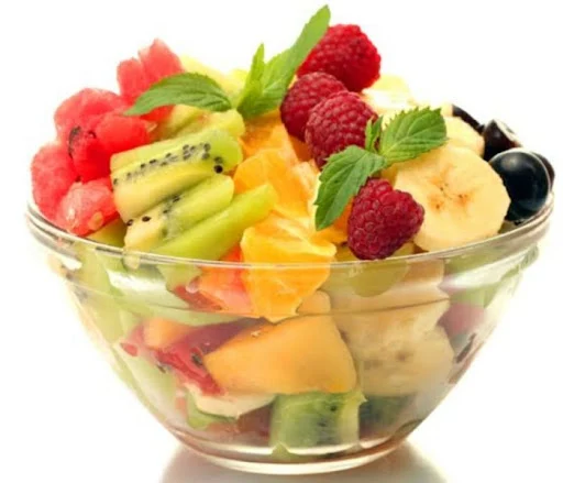 Fresh Fruits With Honey And Dry Fruit Toppings