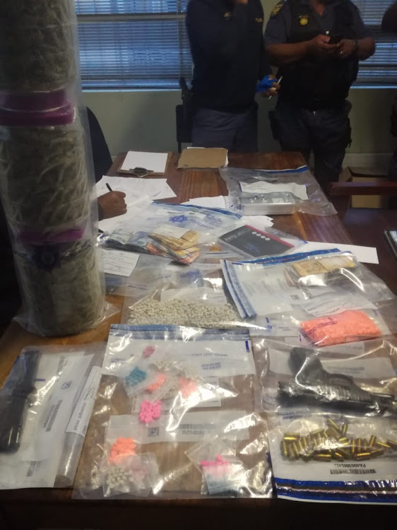 Some of the drugs and other items seized by the anti-gang unit in a raid on two residences in Plumstead on Friday.