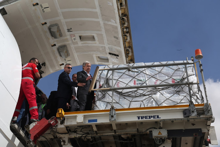 UN secretary-general Antonio Guterres inspects aid for Palestinians, as officials wait to deliver aid to Gaza through the Rafah border crossing between Egypt and the Gaza Strip at Al Arish airport, Egypt, on October 20 2023. Picture: AMR ABDALLAH DALSH/REUTERS