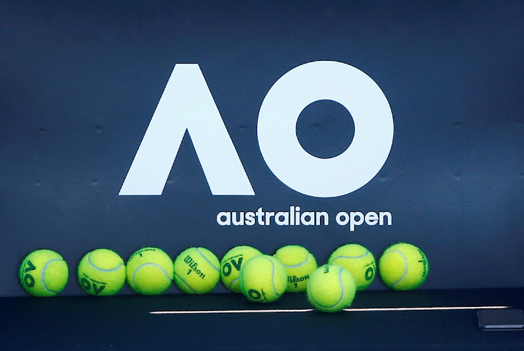 Tennis balls in front of the Australian Open logo