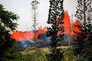 Lava erupts on the outskirts of Pahoa during ongoing eruptions of the Kilauea Volcano in Hawaii, US, May 19, 2018. 