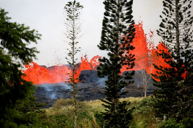 Lava erupts on the outskirts of Pahoa during ongoing eruptions of the Kilauea Volcano in Hawaii, US, May 19, 2018.