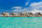 The ocean villas at the Fushifaru Maldives Resort.