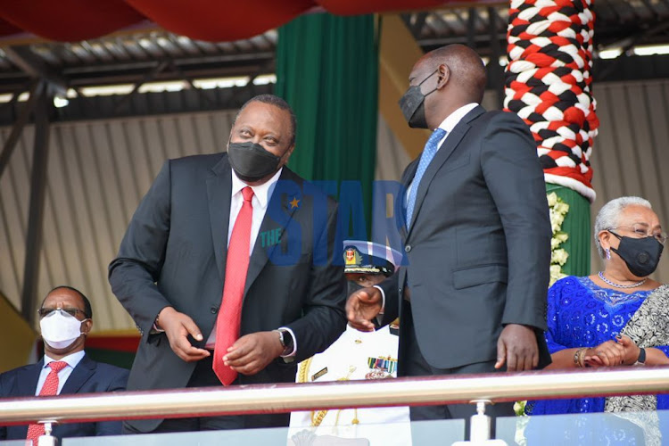 President Uhuru Kenyatta with his deputy William Ruto during Mashujaa Day celebrations at Wang’uru Stadium in Kirinyaga county on October 20, 2021.