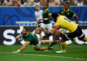 Cobus Reinach scores the Springboks' first try in their 2023 Rugby World Cup pool B match against Romania at Stade de Bordeaux on Sunday.