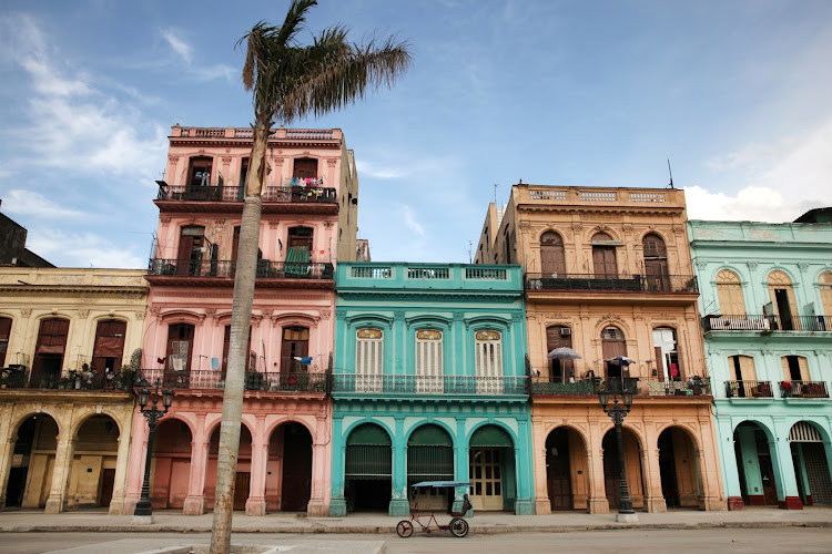 Colourful buildings and historic colonial architecture on Paseo del Prado in Havana, Cuba.