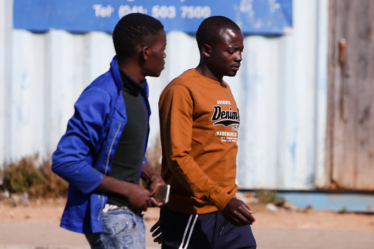 Nelson Mandela Bay residents have dropped their masks with the move to level two, claiming they are an irritation or the weather is too hot to don the protective wear. Among them are these men in Tyinira Street in Motherwell