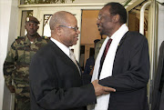 Mali's new Prime Minister Diango Cissoko (L) and Mali's interim President Dioncounda Traore stand at the Presidential residence in Bamako on December 12, 2012. Cissoko is a veteran civil servant who has served several regimes over the past three decades and is now tasked with reuniting a nation split in two by Islamic extremists.