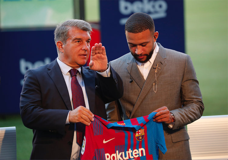 Barcelona president Joan Laporta with new signing Memphis Depay with during the presentation