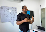 Samuel Anyaele teaches coding using a phone in Lagos, Nigeria, on May 19 2021. 
