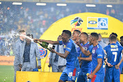 SuperSport United players Teboho Mokoena,Sipho Mbule,Thabo Manyamane and Grant Kekana celebrates during the MTN 8 final match between Highlands Park and SuperSport United at Orlando Stadium on October 05, 2019 in Johannesburg, South Africa. 