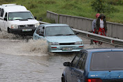 Motorists negotiate their way through Duncan Village in the Eastern Cape after a sudden cloudburst. File photo.