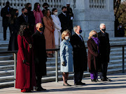 Former US President Bill Clinton with his wife, former Secretary of State, Hillary Clinton, former US President George W. Bush with his wife Laura Bush, and former US president Barack Obama and his wife Michelle Obama wait for US President Joe Biden at the Arlington National Cemetery, in Arlington, Virginia, US, January 20, 2021. 