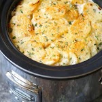 Slow Cooker Cheesy Scalloped Potatoes was pinched from <a href="http://damndelicious.net/2016/11/17/slow-cooker-cheesy-scalloped-potatoes/" target="_blank">damndelicious.net.</a>