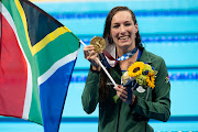 Tatjana Schoenmaker of SA shows her gold medal after winning, with a new world record, the women 200m breaststroke final during the Tokyo Olympic Games.