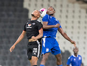 Goodman Mosele of Orlando Pirates and Sifiso Matse of Royal Leopards during the Caf Confederation Cup match at Mbombela Stadium on February 27 2022.