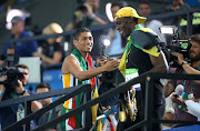 Gold medalist for the men's 400m Wayde Van Niekerk of South Africa congratulates gold medalist of the men's 100m Usain Bolt of Jamaica on day 8 of the Rio 2016 Olympic Games at Olympic Stadium on August 14, 2016 in Rio de Janeiro, Brazil. (Photo by Jean Catuffe/Getty Images)