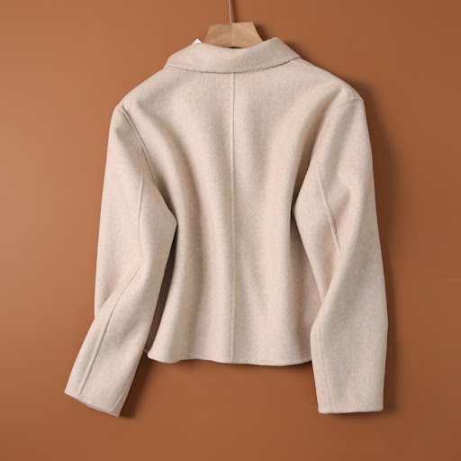 Title 4, Womens Short Woolen Coat in a solid color, a s...