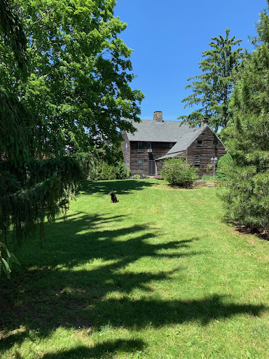 Wooden house with green garden in this luxury property for sale in Westbrook ($600,000)