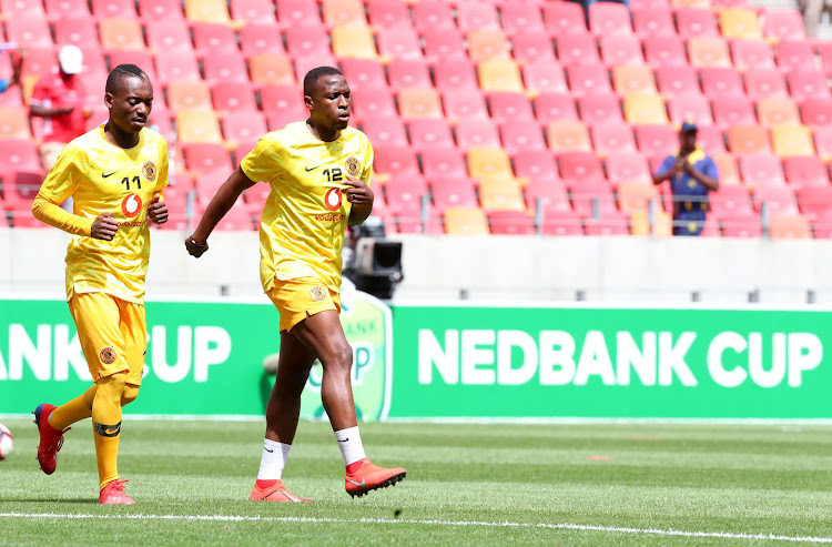 Kaizer Chiefs midfielder George Maluleka (R) with his teammate and forward Khama Billiat (L) during a warm-up session ahead of kickoff.