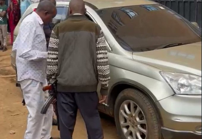 Police officers near the car in which the Mugota was shot dead in Kasarani on Tuesday May, 17, 2022