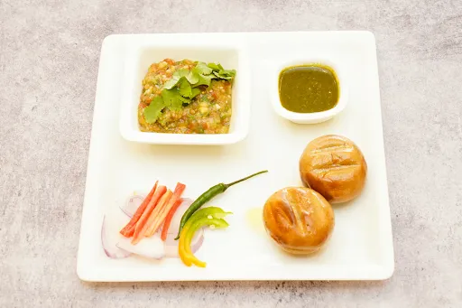 Litti Chokha [2 Pieces] Dipped In Deshi Cow Ghee With Salad