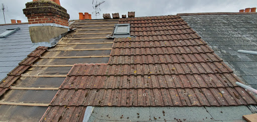 Take off old tiles and replaced with new Spanish slate 