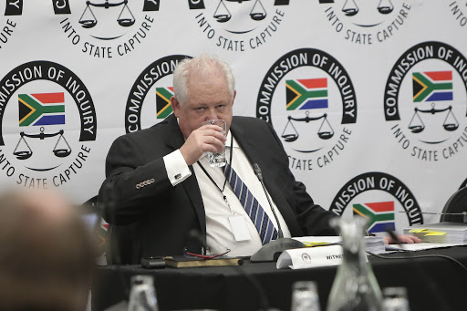 A former executive at corruption-accused facilities management company Bosasa, Angelo Agrizzi, prepares to give testimony on January 16 2018 at the state capture inquiry in Parktown, Johannesburg.