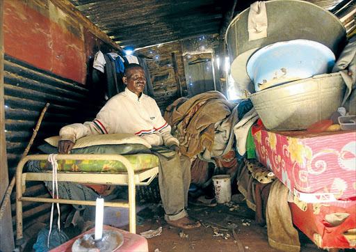 DEPENDENT: Blind Abram Tsotetsi has his neighbours to thank for his ration of water PHOTOS: ANTONIO MUCHAVE