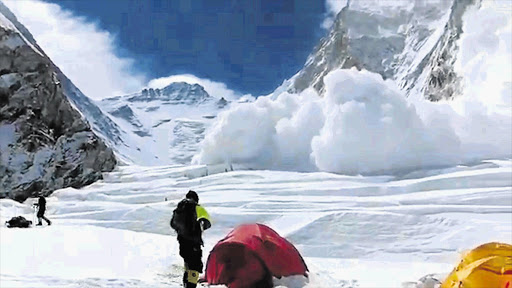 WRONG SORT OF RUSH: The avalanche that killed 13 Sherpas as it barrelled down Mount Everest at the weekend. Rescuers found the body of a 13th Nepalese guide yesterday Picture: BUDDHABIR RAI/AFP PHOTO