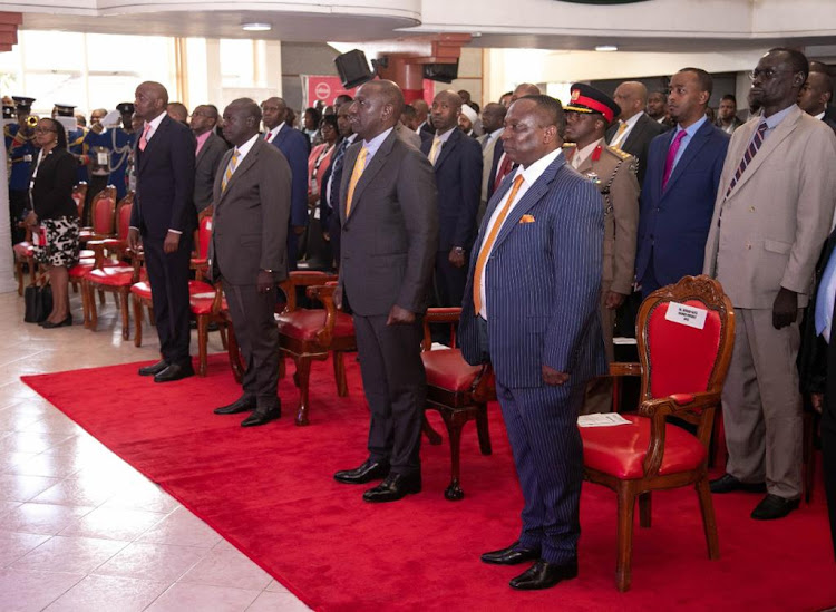 KNCCI boss Richard Ngatia, President William Ruto, DP Rigathi Gachagua and Trade CS Moses Kuria at the Kenya National Chamber of Commerce and Industry annual general meeting at St Andrew's Parish Hall, Nairobi