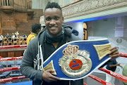 Duduzane Zuma with a WBF belt inside a boxing ring in Pietermaritzburg.