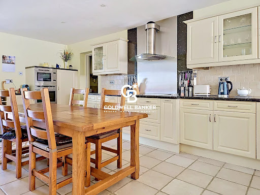 Kitchen with wooden table and cream cabinets - Luxury property for sale in Saint-Grégoire-d'Ardennes, 8 rooms, 5 bedrooms
