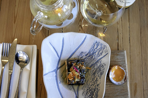 Hake served on a beautiful ceramic dish.