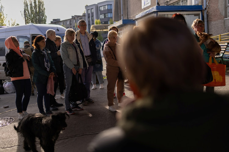 Local residents during an evacuation effort at a bus station in the outskirts of Kherson, Ukraine, on May 4 2023. Picture: REUTERS/CARLOS BARRIA