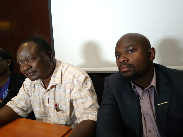 Kenya Tobacco Control Alliance chairman Joel Gitali and head of programmes Thomas Lindi address the press on tobacco addiction.